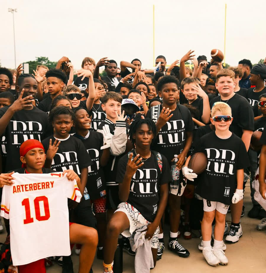 Kids in Rashee Rice Legacy Foundation shirts at a youth football camp