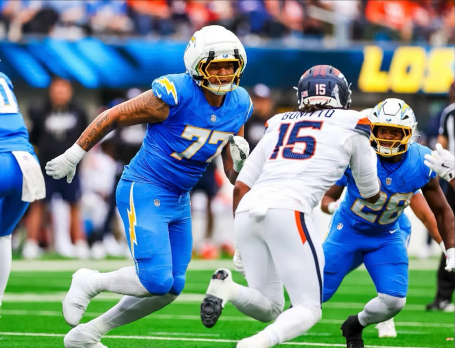 Los Angeles Chargers number 77 blocking against Denver