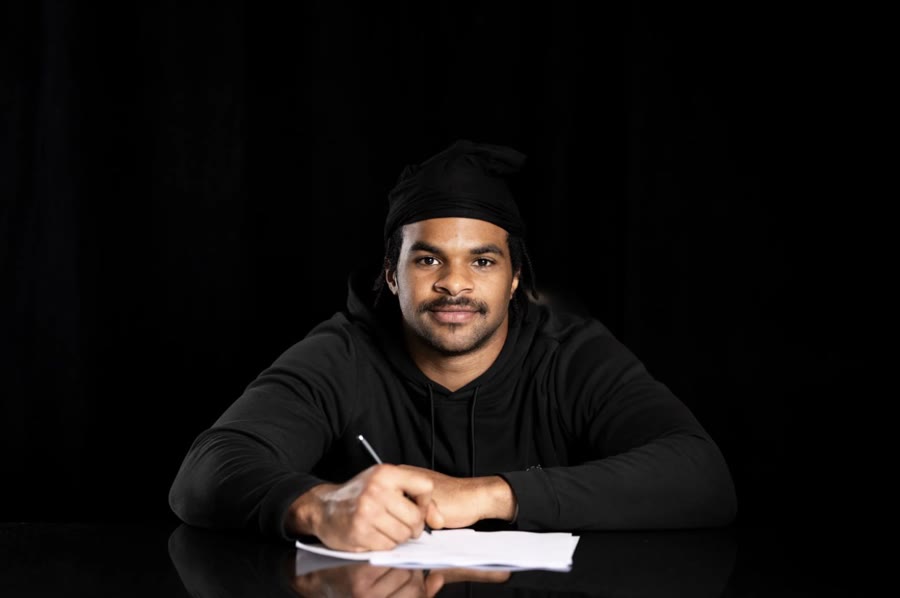 Isaiah Smith signing his rookie contract with the Carolina Panthers