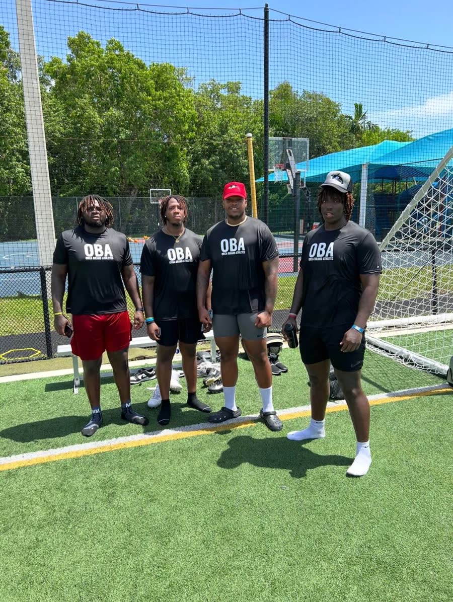 Four clients in Orca Brand Athletes shirts at an offseason training session